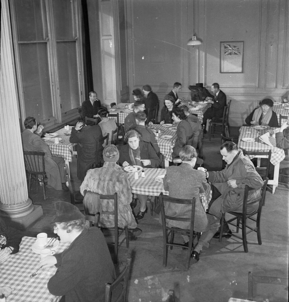 Patrons sitting at tables enjoying their meals, at some point in the 1940s.