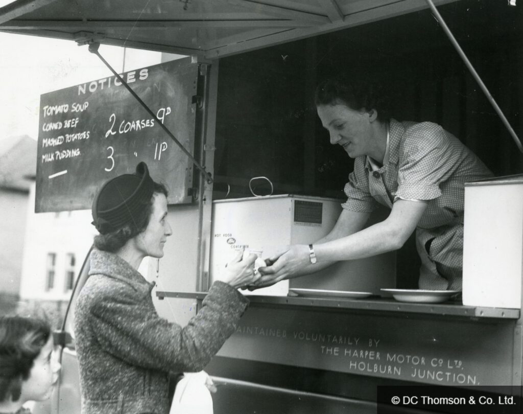 Woman being served at a mobile canteen van in wartime Britain