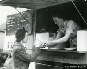 Woman being served at a mobile canteen van in wartime Britain