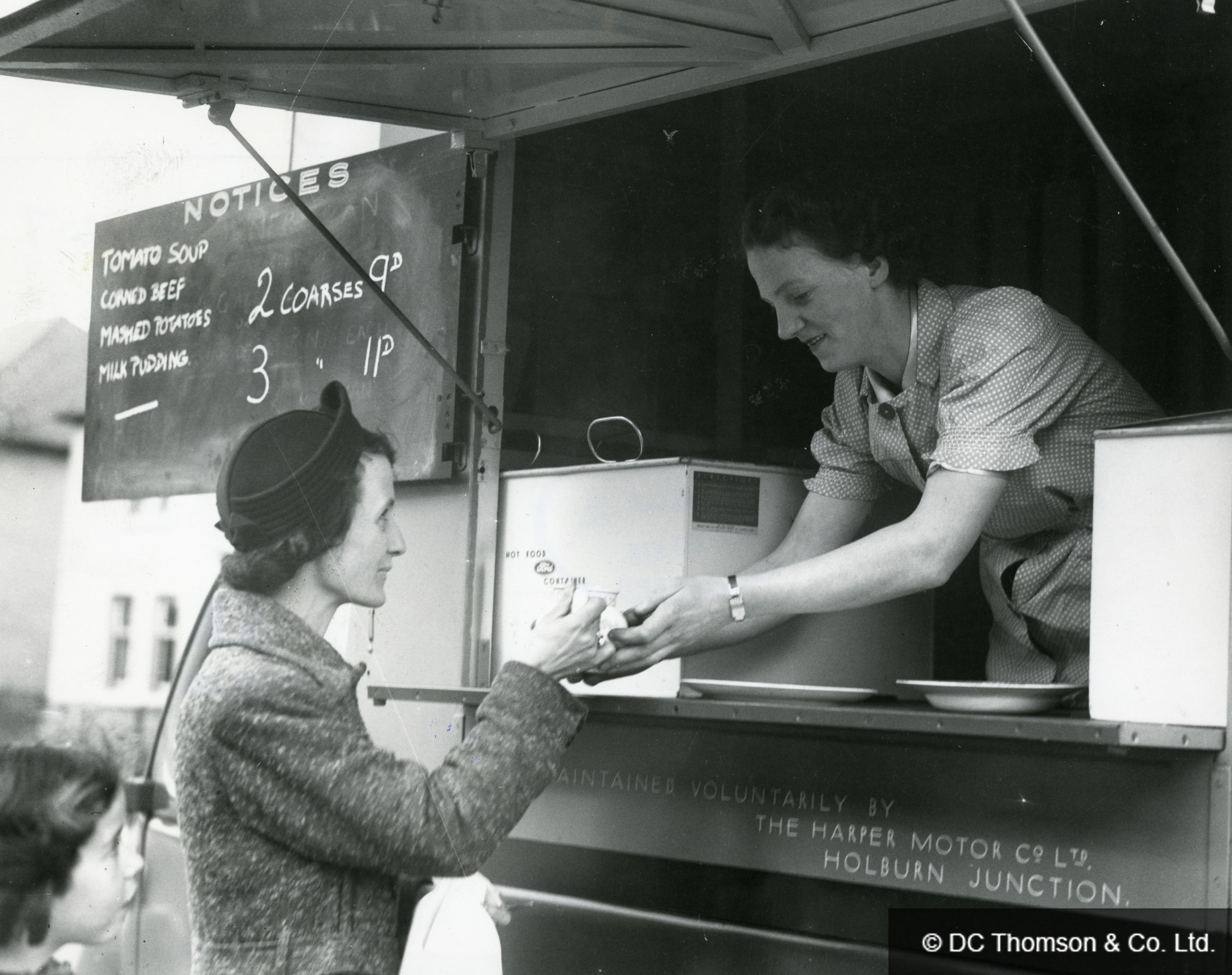 Woman being served at a mobile canteen van in wartime Britain