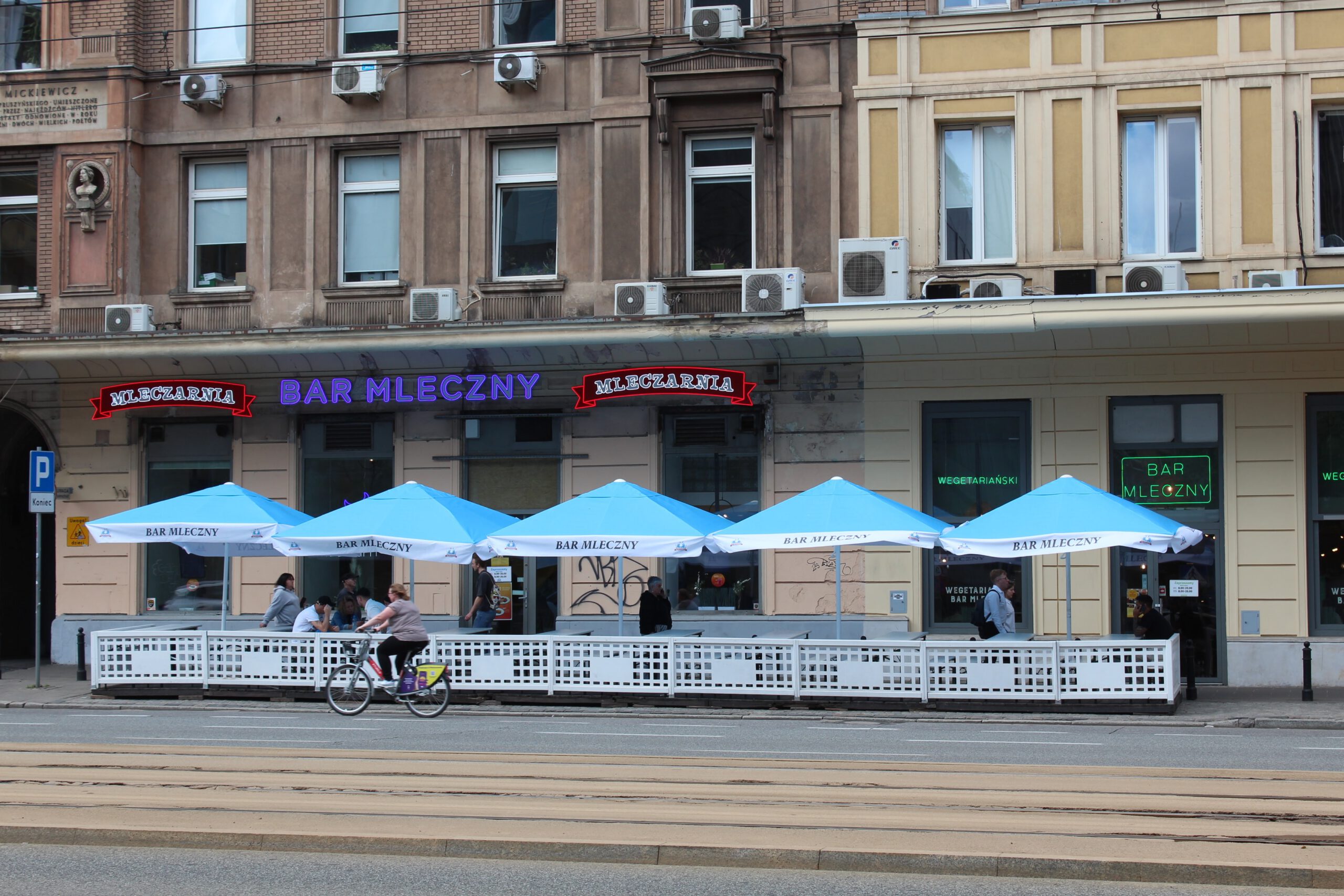 Outside view of a Polish milk bar with large covered outdoor seating area